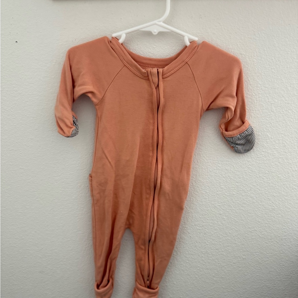 Goumi Peach One Piece Bodysuit with Long Sleeves and Footed Design